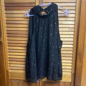 Sleeveless black tank top with gold diamonds